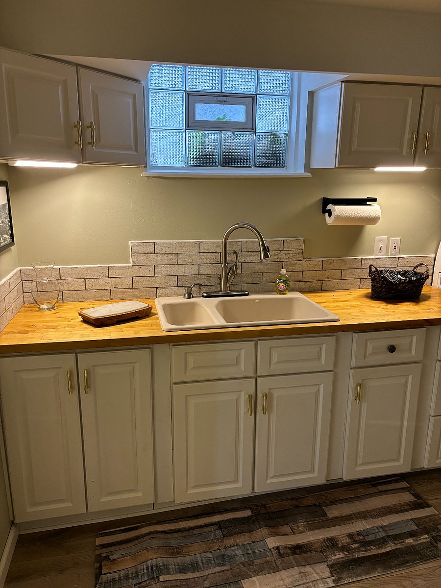 Deep sink with plenty of cabinet storage. All cookware and dishware is furnished.