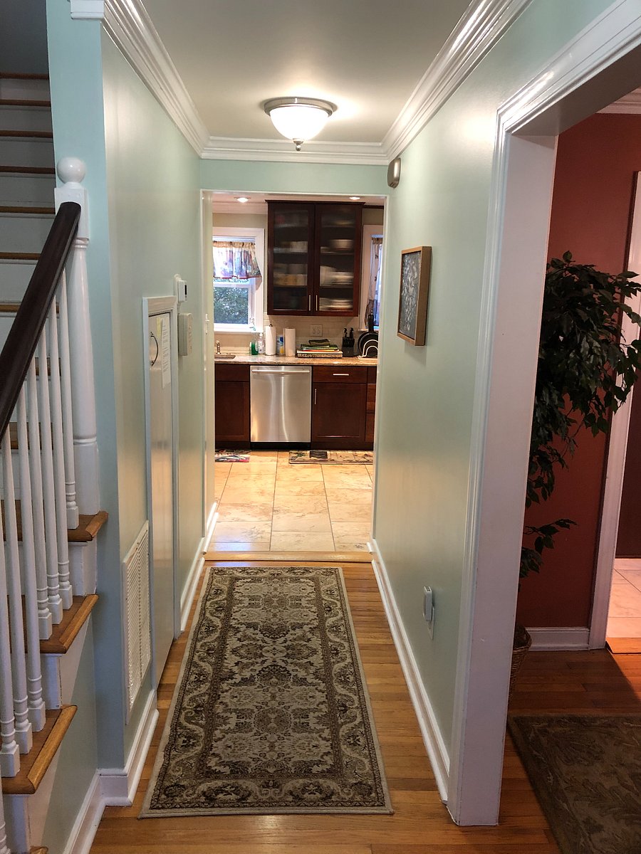 View from front door and stairs to kitchen