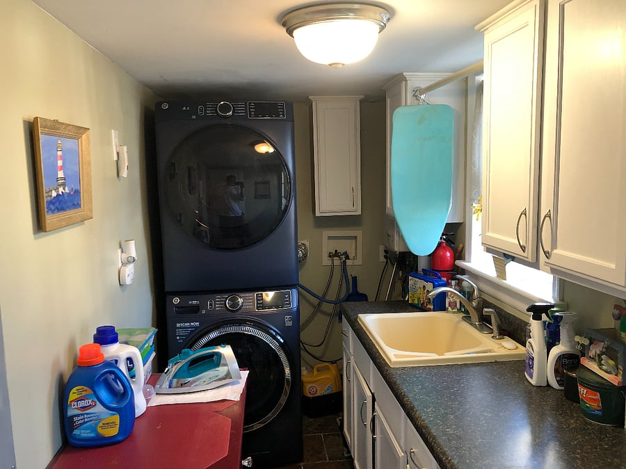 New washer/dryer 2023.Iron board/iron and portable clothes steamer/sink. Side door entrance to outside from this room