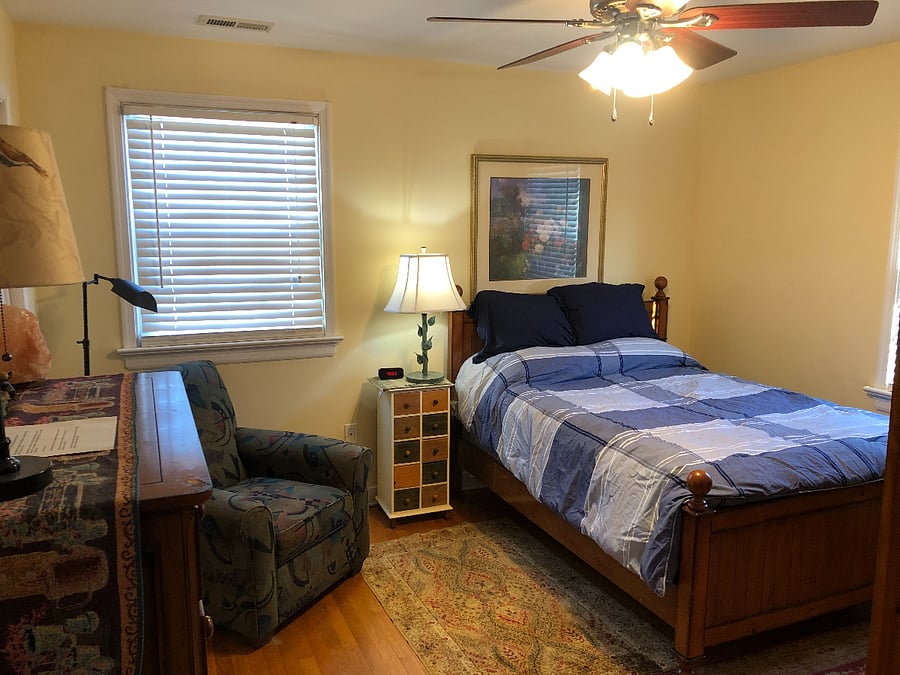 TV and closet in this room along with ceiling fan