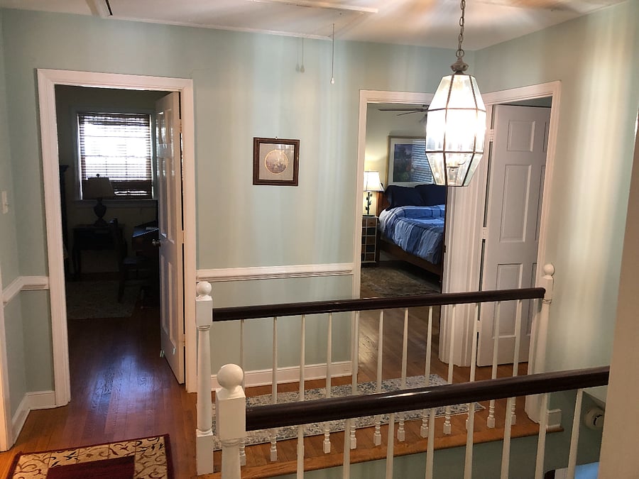 upstair landing area facing two bedrooms. The other two are opposite side. TV/cable in 3/4 bedrooms.Ceiling fans in all rooms