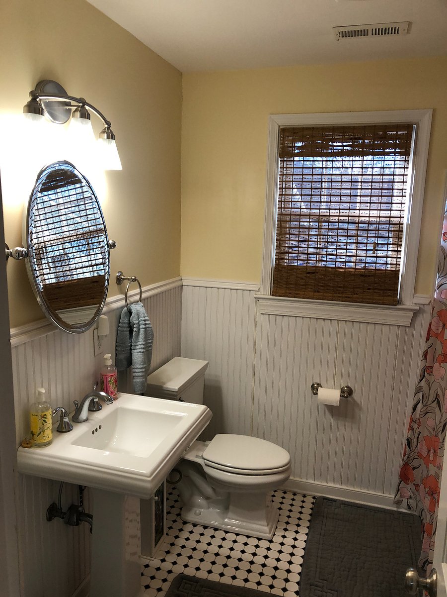 upstairs near stairs & other bedrooms. tub off to right
