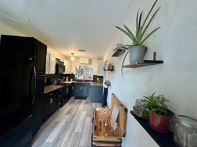 Kitchen with a fresh herb wall if wanted to be kept - can remove herbs for less maintenance if wanted.