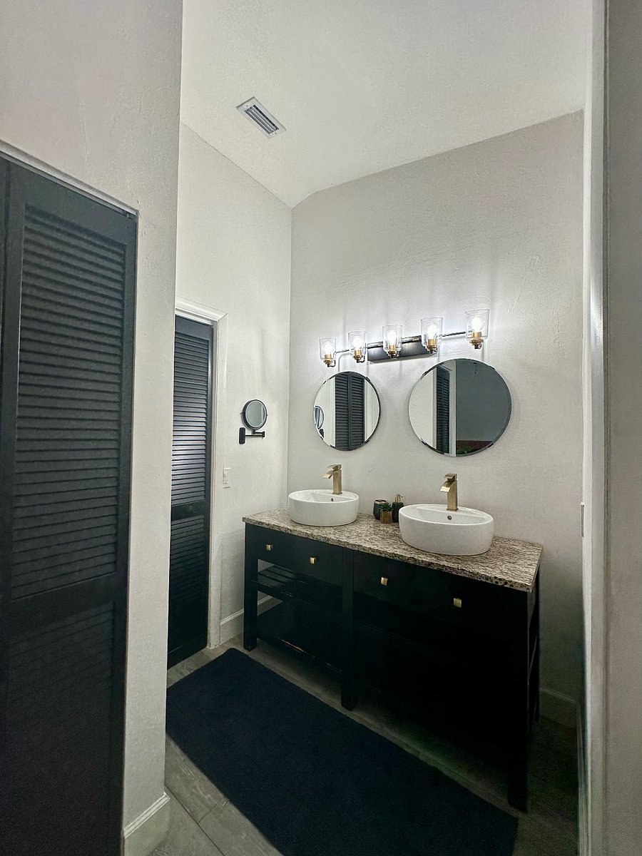 Master vanity and massive walk-in closet with built in organization.