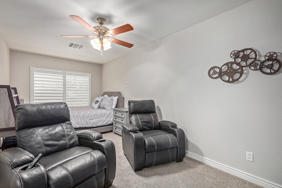 4th Bedroom (off the living room) has a Queen bed, nightstand, clothing tote shelf area, tv and 2 two media chairs.