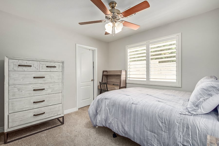 Bedroom 3 has a queen bed, desk, nightstand, dresser and walk-in closet