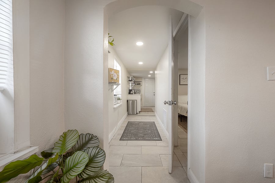 The bedroom is located down the hallway