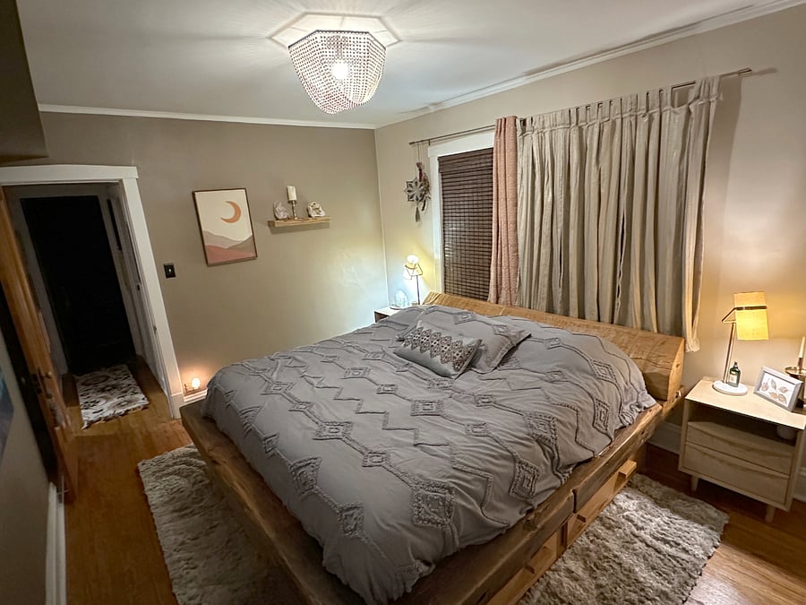 I designed and commissioned this reclaimed wooden beam bed with drawers below. The wood came from a paper factory on the south side!