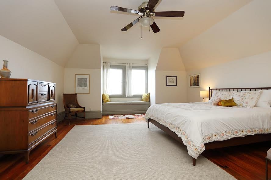 Bedroom with king size bed and views of City Hall and downtown San Francisco.