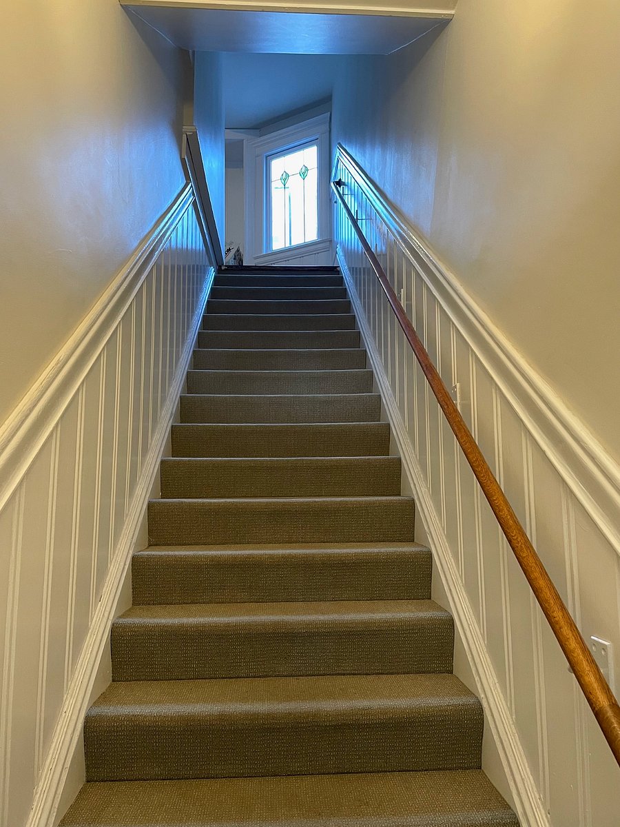 First interior staircase leading to first landing.