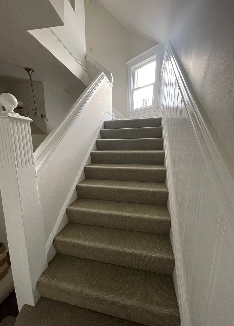 Second interior staircase leading to the private top floor space for rent.