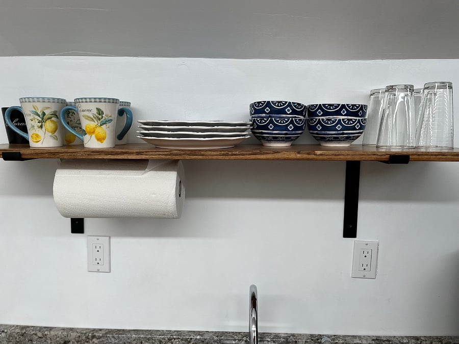 Fully equipped kitchen with dishes, cups, coffee maker, utensils and basic cleaning supplies. 