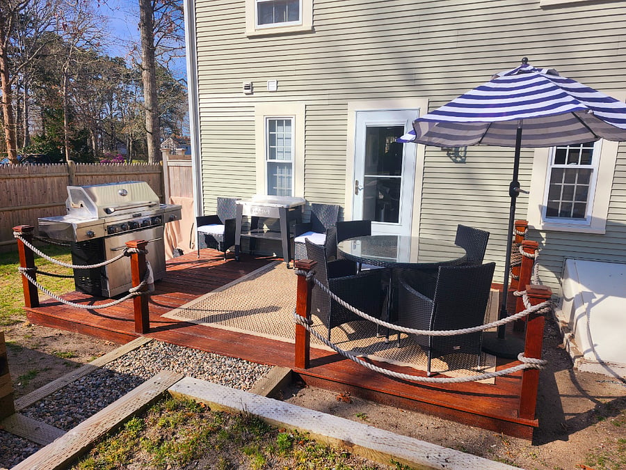 Gas grill and outside dining on the dock inspired deck