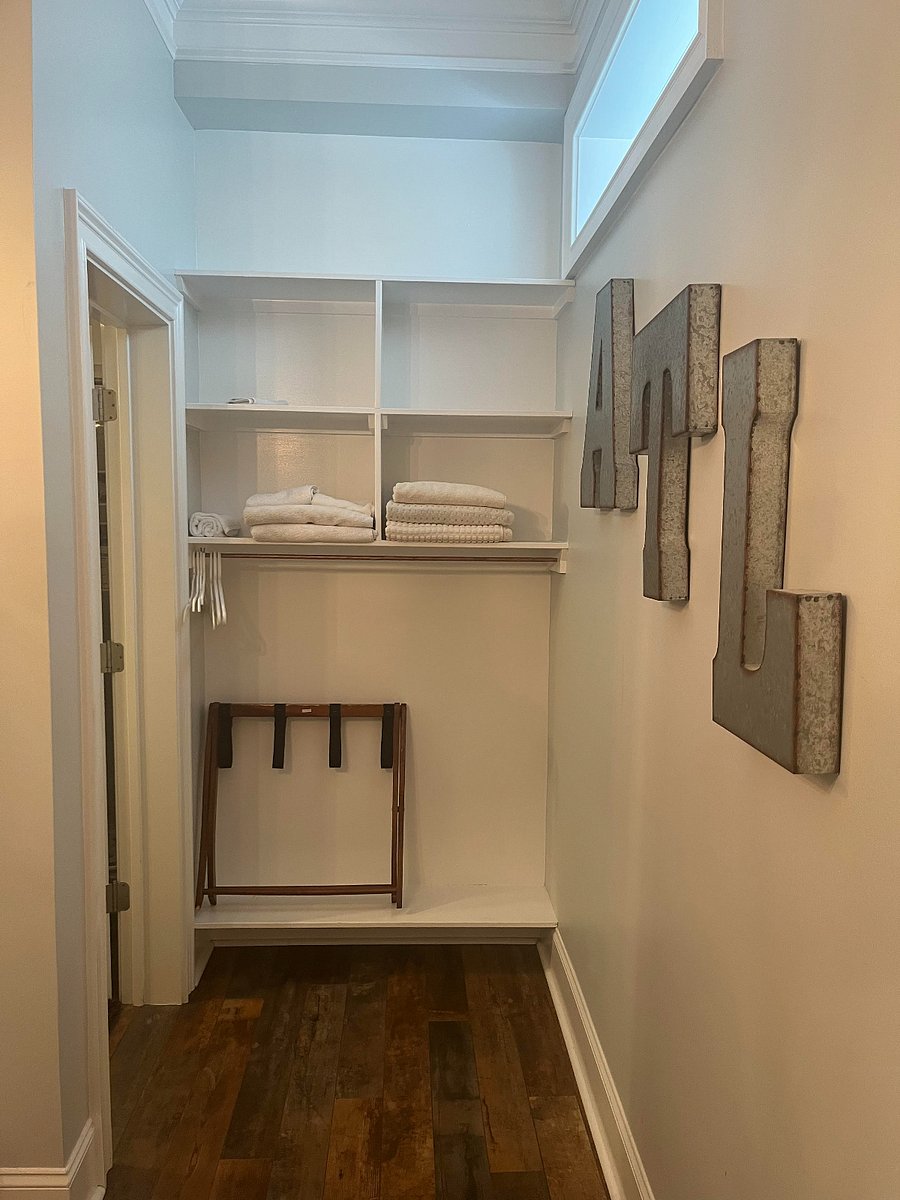 Some closet space near the bathroom