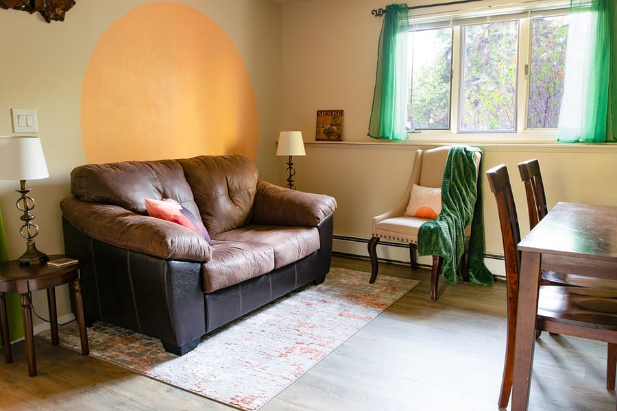 Cozy sitting area with room-darkening blinds; new room-darkening curtains have been added for extra darkness.