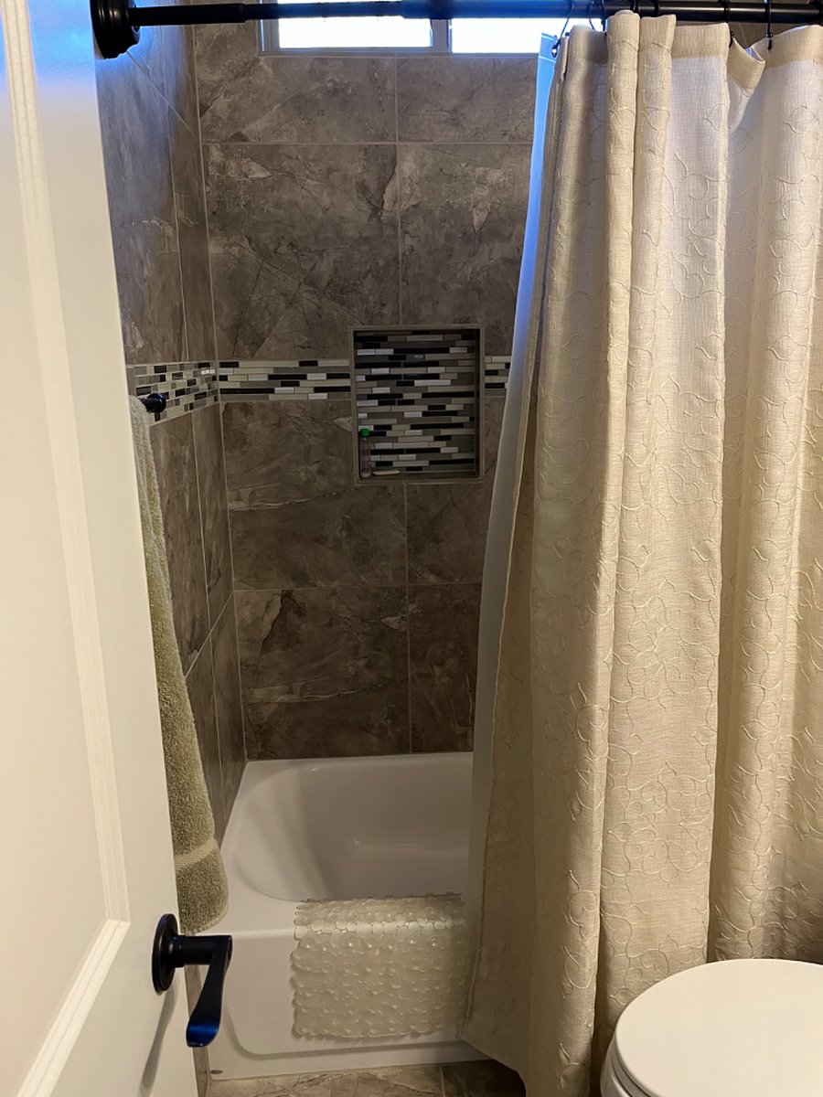 Shower and tub adjoining bathroom