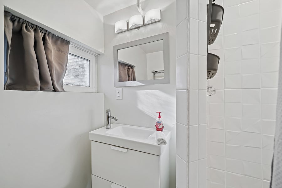 Bathroom with stand up shower stall. E