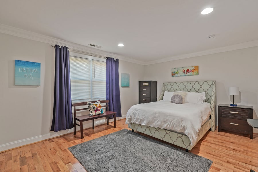 Master bedroom w/bathroom in suite, sitting bench, spacious closet, 50 inch smart tv & room darkening shades