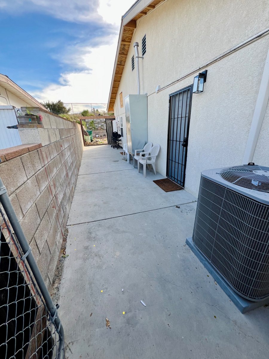 Upon Entry of Gate - Bedroom 1 Door/Little patio seating area (will have an awning above door soon).