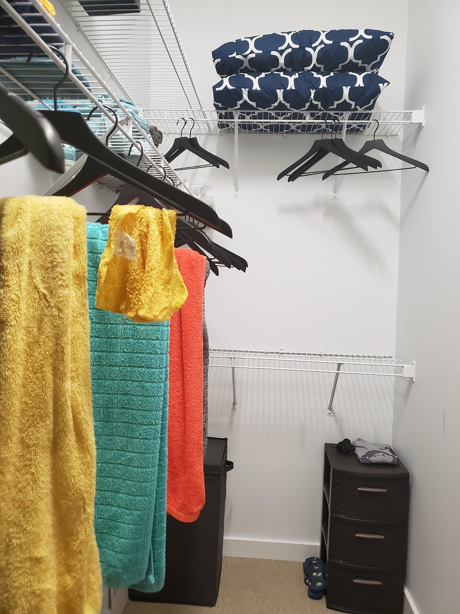 Super spacious walk-in closet stores ALL of your clothes, shoes, plus more! Additional storage and shelving for cleaning supplies, etc., in cubby to your left under water heater.