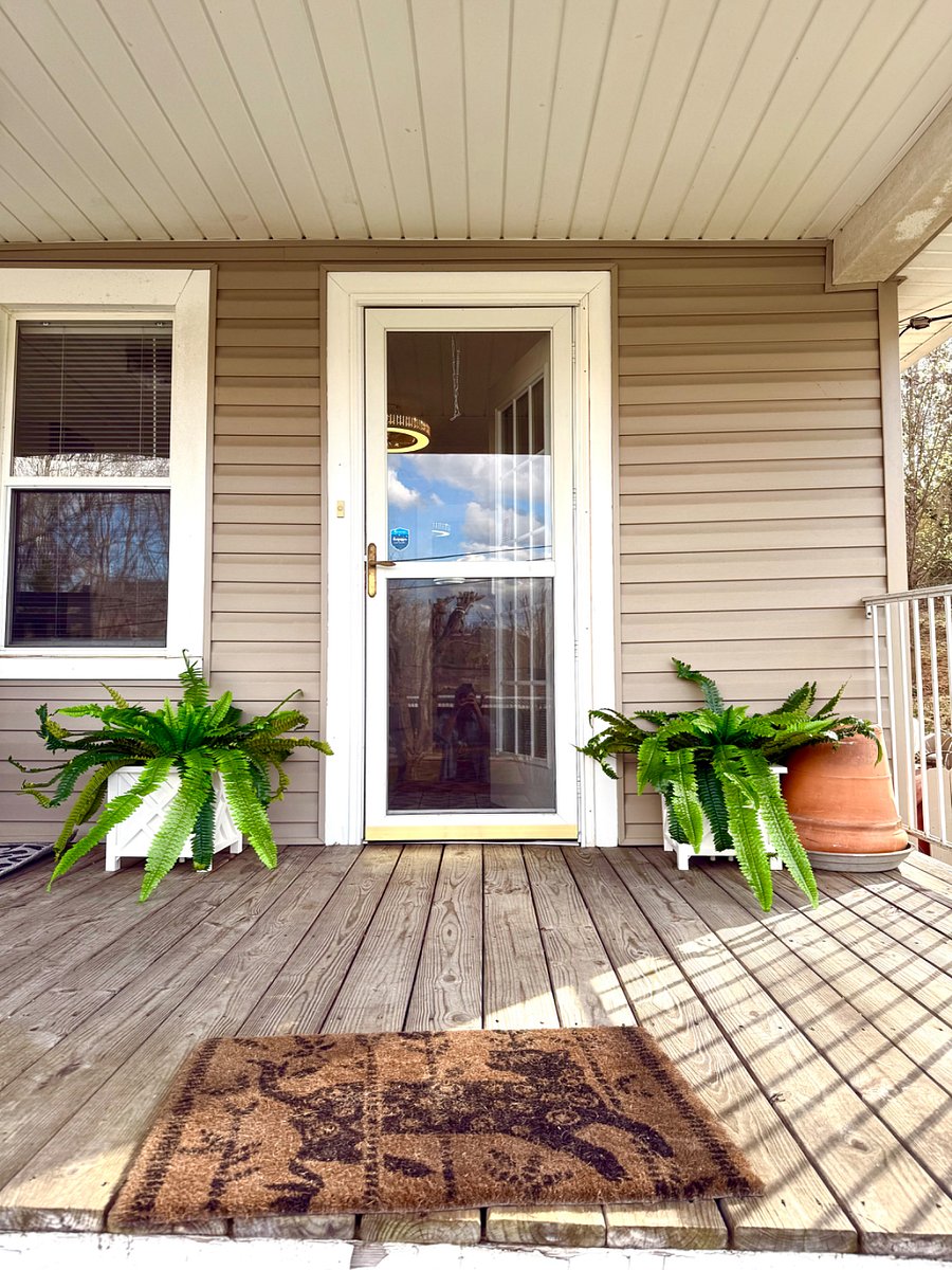 Front Porch Entrance to The Bad Kitty Cottage with security cameras at front and back porch entrances for additional safety and motion sensor lighting!