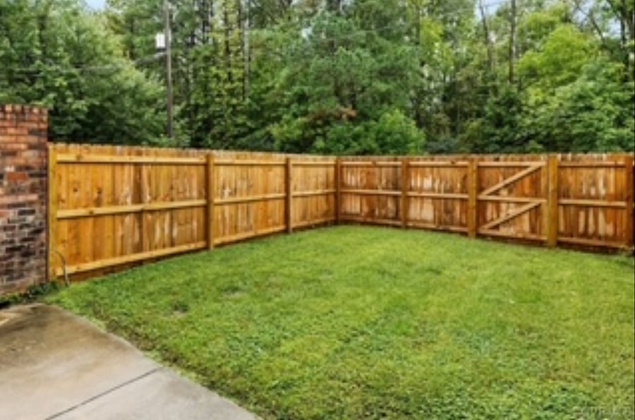 Spacious fully-fenced backyard, equipped with patio set and grill for al fresco dining. Inclusive weekly exterior landscaping/maintenance.