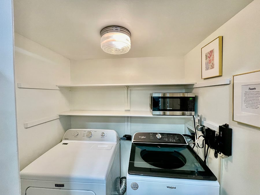 Laundry room with oversized washer and dryer, as well as extra storage/pantry space