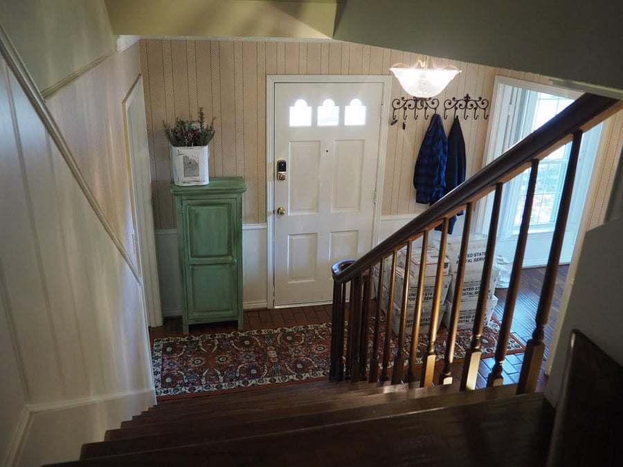 Front door with steps to rented area on 2nd floor