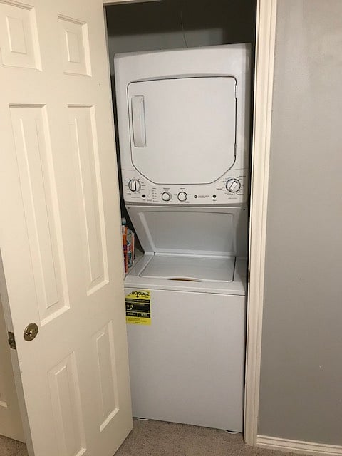Washer - dryer unit in seating area room