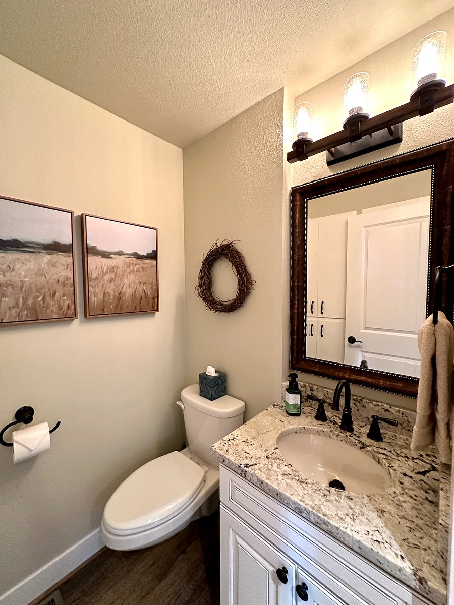 The powder bathroom downstairs. This bathroom has built in cabinets for all your extra storage needs.
