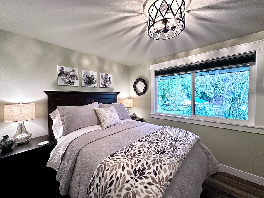 The downstairs bedroom has a full size bed. The bed has 6 storage drawers built into it and there is a large closet to store all your clothing and belongings. The bedroom door has a locking handle. There is also a wall mounted flat screen smart TV and pull down blackout cellular room darkening shades.