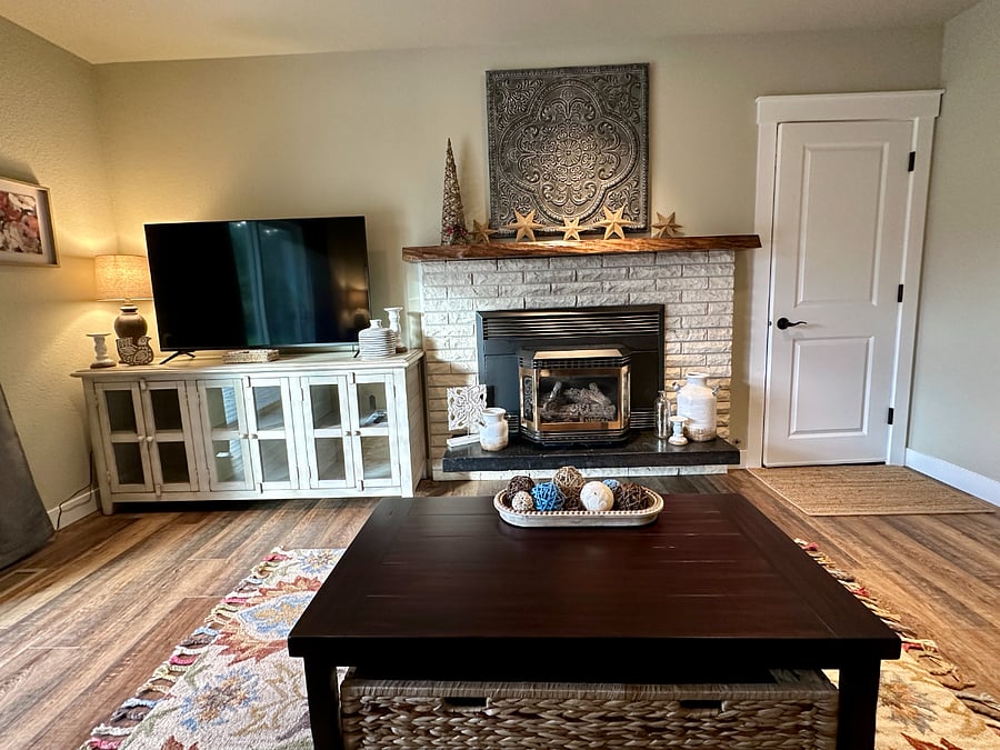 The den is tastefully decorated but maintains all the comforts of home. Turn on the fireplace with the flick of a switch and in the warmer summer months, you can enjoy central air conditioning!