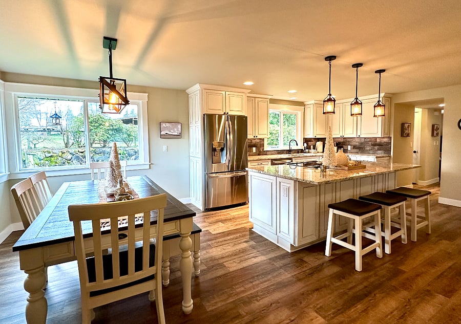 The dining room features a brand new table, chairs and storage bench to gather together for wonderful meals and games!!