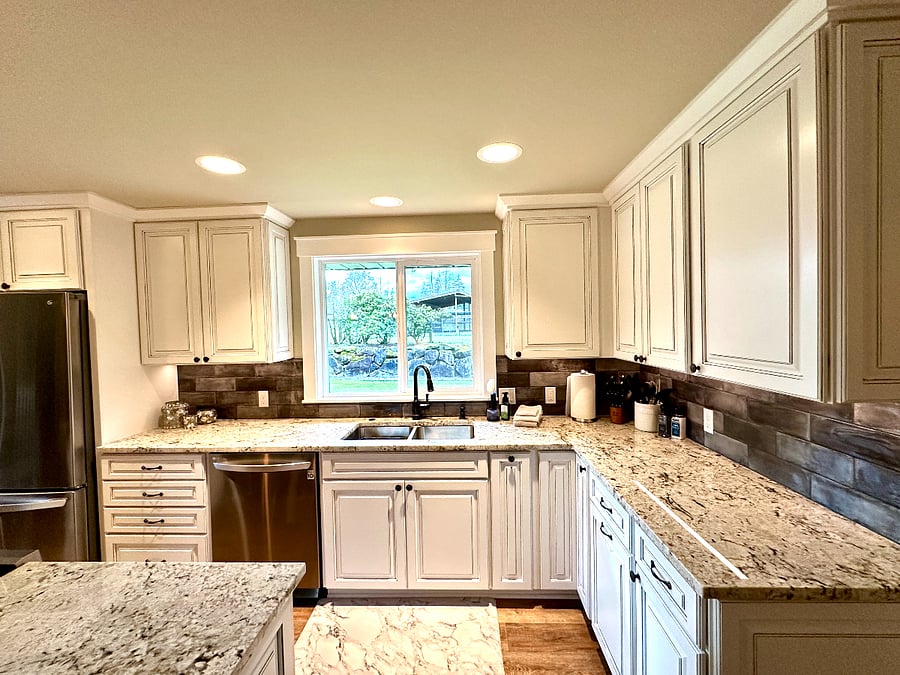 The open layout of the kitchen space allows for ease of meal prep, while others can relax or eat at the large granite island. You'll find all the tools and small appliances you'll ever need to get your culinary work done!