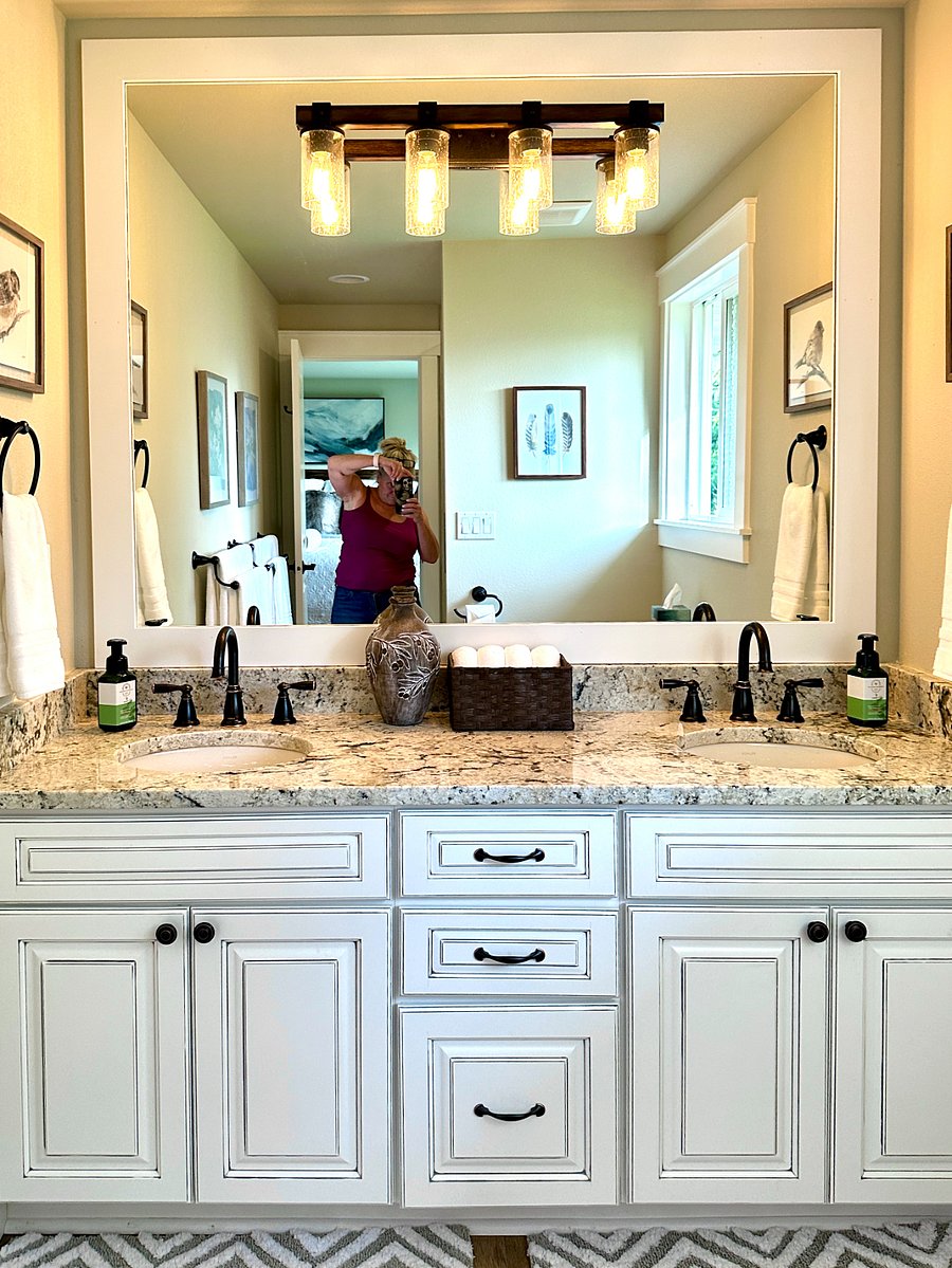 The elegant master bathroom features all new custom cabinets, oiled bronze plumbing fixtures, luxurious walk-in tile shower, stylish lighting and hotel quality towels. A starter supply of shampoo, conditioner and body wash is included.