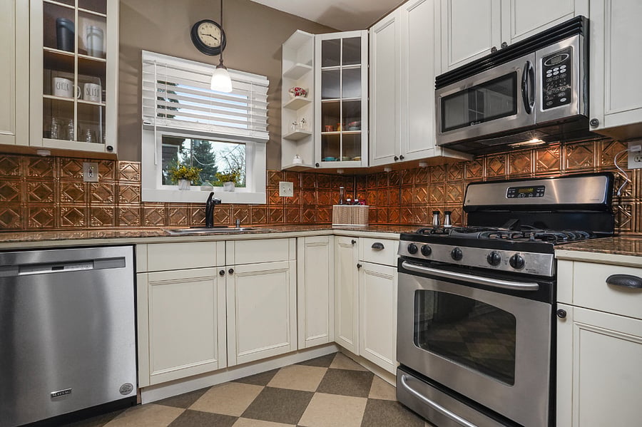 Full size dishwasher, gas stove top/range and built-in microwave.