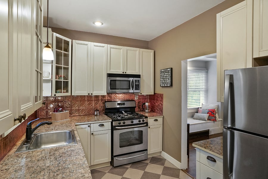 Fully loaded kitchen with stainless steel appliances.