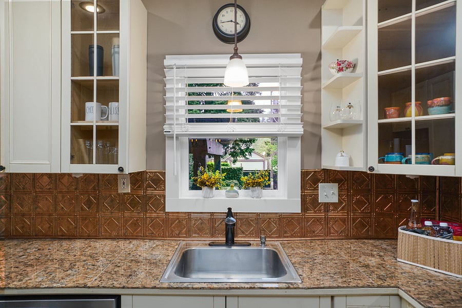 Kitchen window looks out to back yard.