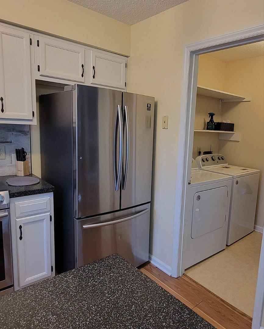 Laundry room with full size washer and dryer