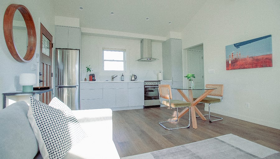 Open floor plan with modern kitchen aisle and brand new appliances
