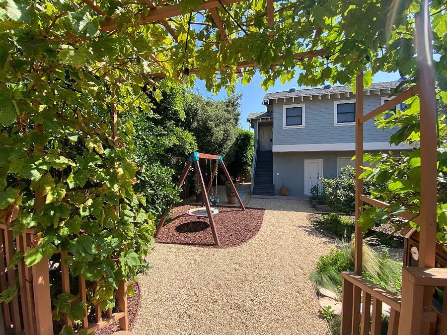 Landscaping with river rock pebbles and plenty of greenery