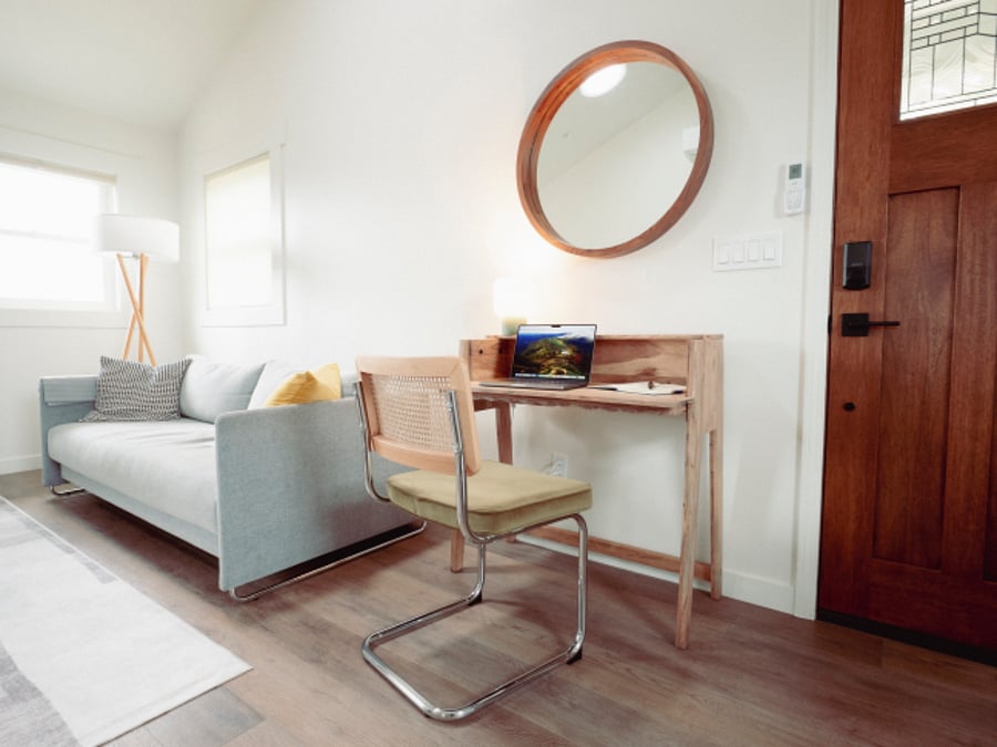 This beautiful side table converts into a dedicated workspace / desk if you need to get work done
