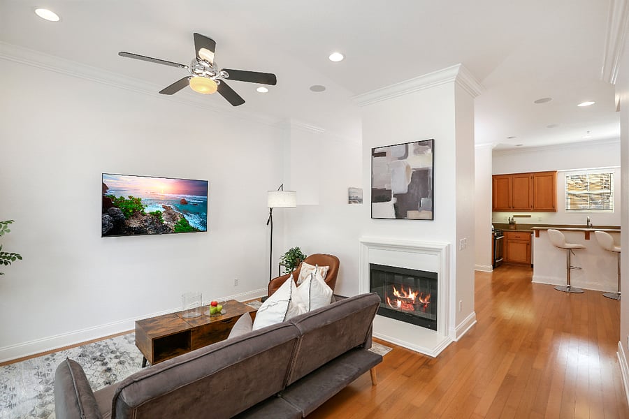 The living room also has an electric fireplace for added coziness.