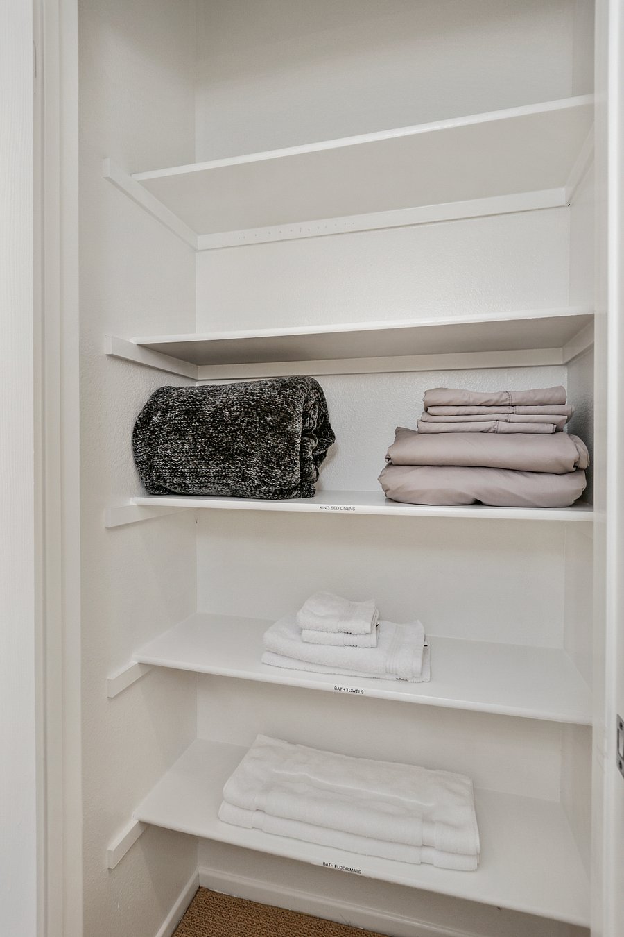 In the primary bathroom is additional storage for linens. All guests will receive 2 sets of towels and bed linens for their stay.