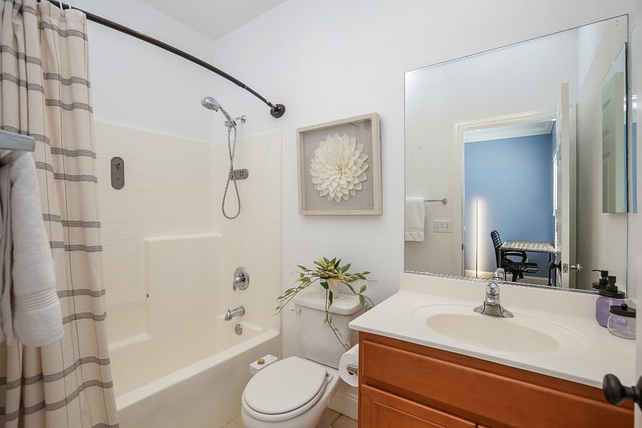 Bathroom 2 with shower bathtub, toilet and sink.