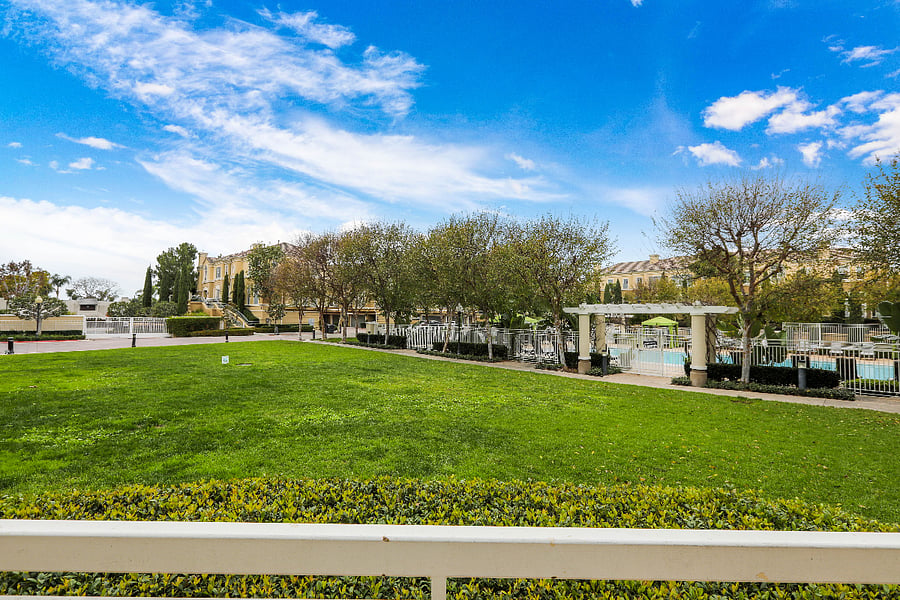 Outdoor green space next to the pool.