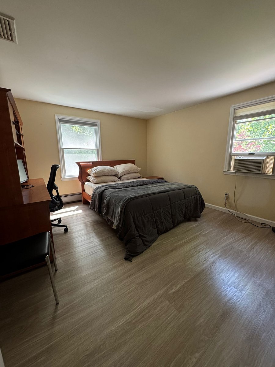 Bedroom with queen size bed and has a very long double wide closet (8' long) with tons of room for clothing. Room also includes credenza/desk for computer workstation. Comes with a spare monitor for hook up to your laptop.