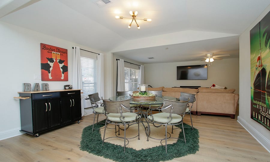 dining area opens to living and kitchen