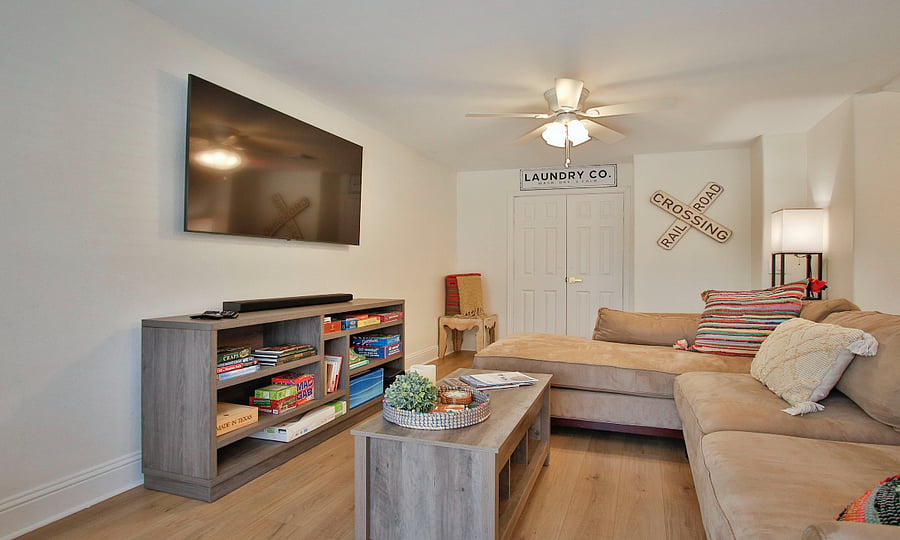 Living area with another work area.  Table opens up to desk for laptop