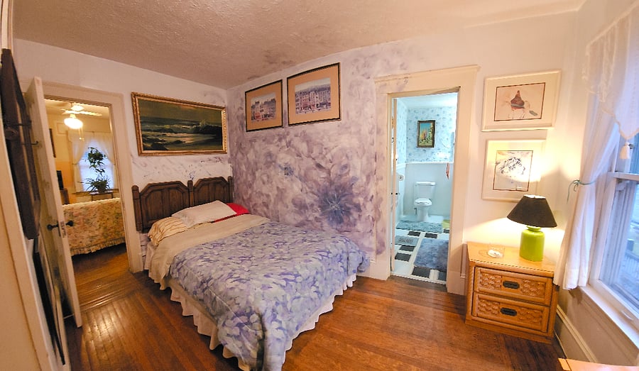 bedroom next to original bathroom